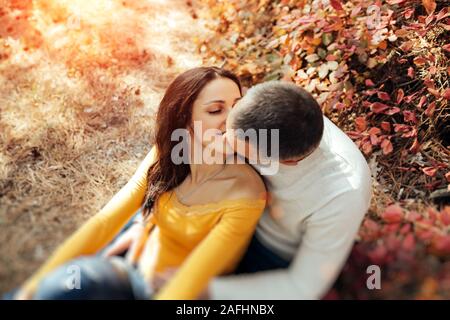 Kissing couple silhouette autumn day love park hi-res stock