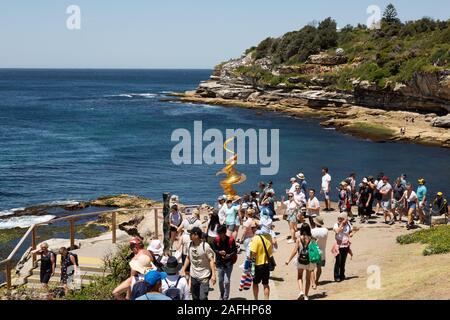 People walking on the Bondi Sculpture by the Sea walk from Bondi to Tamarama beaches, Sydney Australia Stock Photo