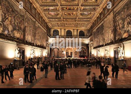 FLORENCE, ITALY - MAY 1, 2015: People visit Palazzo Vecchio in Florence, Italy. The landmark serves as City Hall of Florence and was built in 13th cen Stock Photo