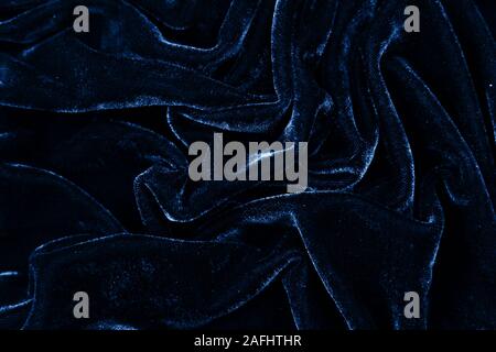 drity blue fabric closeup. Velvet texture background. Classic blue color of year 2020 Stock Photo