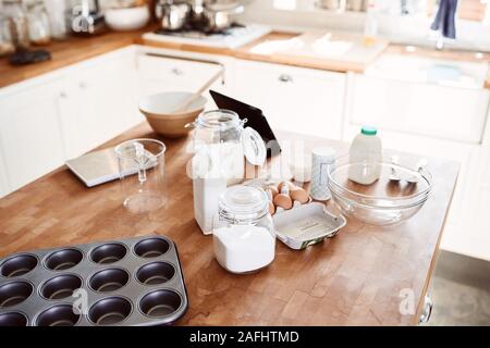 Ingredients And Baking Utensils Laid Out On Work Surface In Kitchen Stock Photo