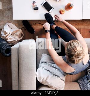 Overhead Shot Looking Down On Woman At Home Getting Ready To Go To Fitness Class Stock Photo