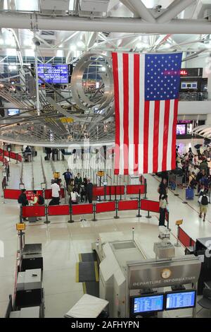 NEW YORK, USA - JUNE 7, 2013: People hurry at Kennedy Airport in New York. In 2012, the airport handled 49.3 million passengers (6th busiest in the Un Stock Photo