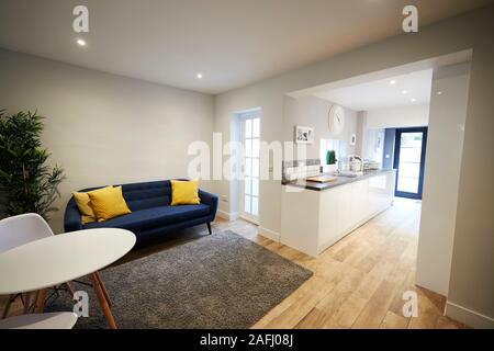 Sitting room and kitchen in newly refurbished house Stock Photo