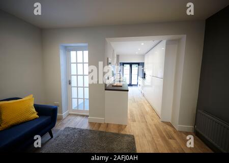 Sitting room and kitchen in newly refurbished house Stock Photo