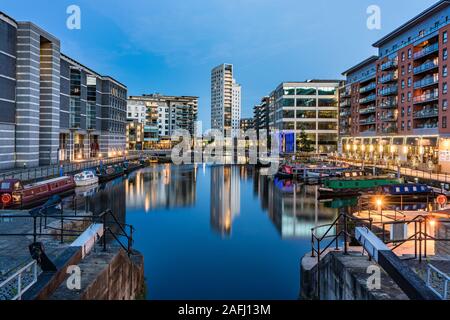 LEEDS, UNITED KINGDOM - AUGUST 13: Evening view of Leeds Dock, a housing, retail and office development where the Royal Armouries Museum is located on Stock Photo