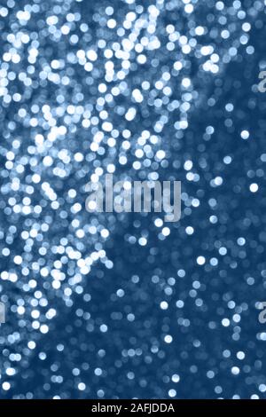 Blue festive background with sparkles in the bokeh. The concept of the celebration, the day of St. Valentine, New Year, birthdays, ceremonies, events, etc. Stock Photo