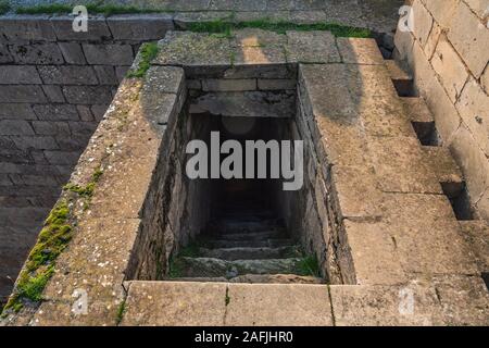 Exit from the dark stone basement Stock Photo