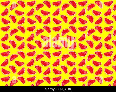 Seamless photo pattern of grapefruit slices on a yellow background. Seamless pattern for your design. Stock Photo