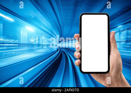 Hand holding smartphone with blue motion blur background. Stock Photo