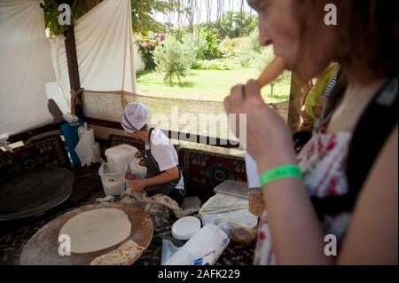 Woman cooking cakes gozleme. Hotel in Turkey Stock Photo