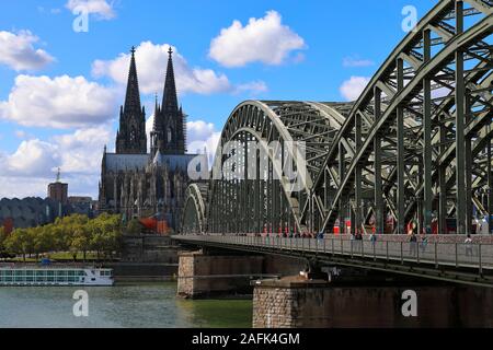 Most iconic view in Cologne is the dome. Commonly viewed over Rhein river and including Hohenzollern bridge. Stock Photo