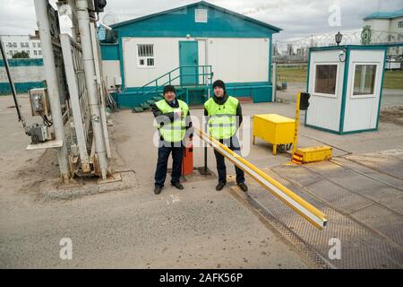 Security guard controls access to territory Stock Photo