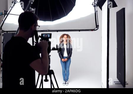 Female Model Working On Set In Photographic Or Film Studio Stock Photo