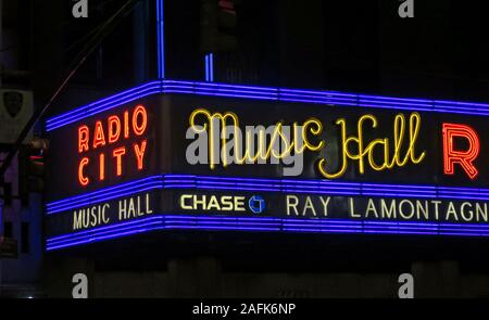 Radio City Music Hall facade New York, 1260 Avenue of the Americas (Sixth Avenue), Manhattan, New York City, NY, USA at night, neon lights Stock Photo