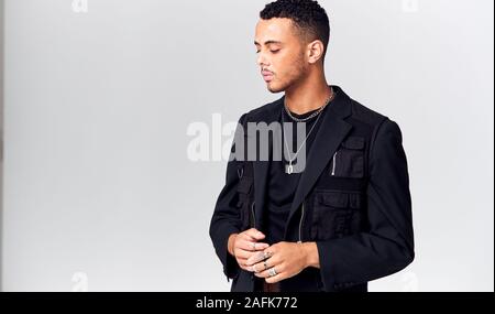 Studio Portrait Of Young Man With Skin Pigmentation Disorder Looking Off Camera Stock Photo