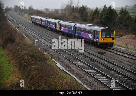 Class 142 Pacers 142088, 142093 and 142096 captured in foul weather make their final journey to the scrap yard at Kingsbury near Tamworth Stock Photo