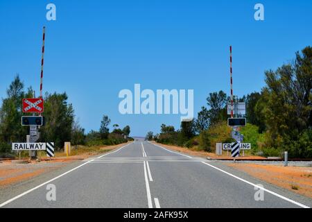 Australia, railway crossing and spread line on Brand  highway in Western Australia Stock Photo