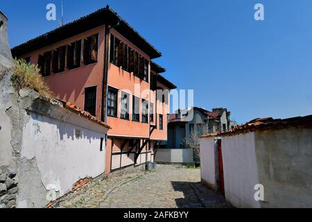 Plovdiv, Bulgaria - June 08, 2018: Building in traditional structure and cobbled street in old town district Stock Photo