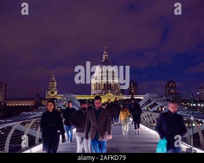 Tourists Crossing Millennium Bridge, River Thames, with St Pauls Cathedral, Night Time London Landscape, England, UK, GB.