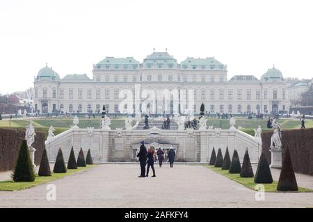 Vienna tourists; Upper Belvedere Palace Vienna; a historic building from the 18th century; tourists in the gardens in winter, Vienna Austria Europe Stock Photo