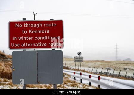 Amulree, Perthshire, Scotland, UK. 16th Dec 2019. Warning sign on single-track U173 Kenmore to Amulree road seen during a wintry snow fall today. Police and Perth and Kinross Council plan to close a five-mile long stretch of the scenic road through Glen Quaich for 17 weeks from 23 Dec 2019 because it is too dangerous in snow and ice. The road through Glen Quaich is regarded as one of the most picturesque, and dangerous, in Perthshire.