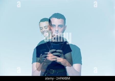 Composite Concept Image Showing Young Man With Mobile Phone Suffering With Social Anxiety Stock Photo