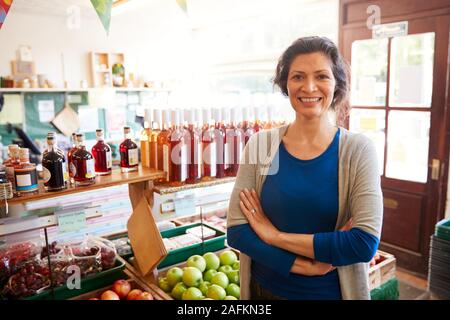 Portrait Of Mature Woman Running Organic Farm Shop Stock Photo