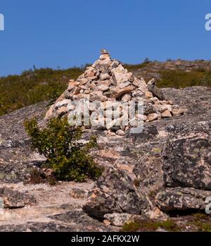 SOMMARØY, TROMS COUNTY, NORWAY - Rock cairn on trail in northern Norway. Stock Photo