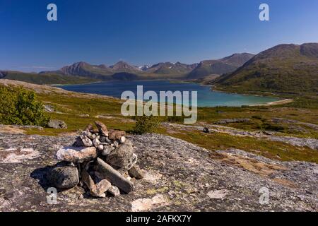 SOMMARØY, TROMS COUNTY, NORWAY - Rock cairn on trail in northern Norway. Stock Photo