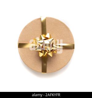 Craft box with golden ribbon isolated on white background. Holiday decoration and gifts. Top view. Valentine present. Stock Photo