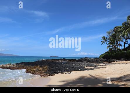 lonely bay on Hawaii Maui beach palm trees Makena Cove Stock Photo