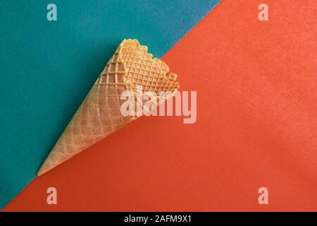 waffle cone on orange and green background, Stock Photo