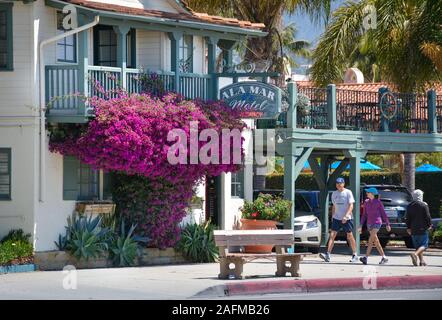 An impressive magenta Bougainvillea plant at the entrance to the quaint Ala Mar Motel on popular Cabrillo Boulevard in Santa Barbara, CA, USA Stock Photo