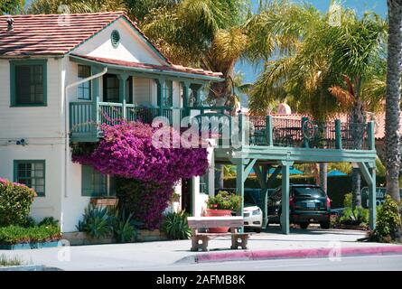 An impressive magenta Bougainvillea plant at the entrance to the quaint Ala Mar Motel on popular Cabrillo Boulevard in Santa Barbara, CA, USA Stock Photo