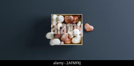 Heart shaped chocolate in golden box isolated on dark gray background, top down view, centered, mock-up, 3d rendering Stock Photo