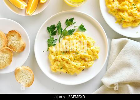 plate of scrambled eggs isolated on white background, top view Stock Photo  - Alamy