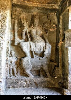 Ajanta caves with Buddha statue and beautiful architectural carvings on the pillars and walls in Aurangabad district, India. Stock Photo