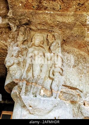 Ajanta caves with Buddha statue and beautiful architectural carvings on the pillars and walls in Aurangabad district, India. Stock Photo