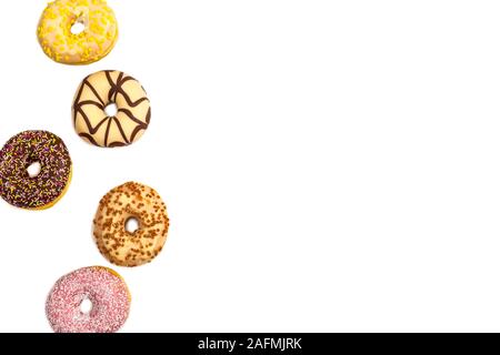 various colored delicious donuts on white background, with the word ...