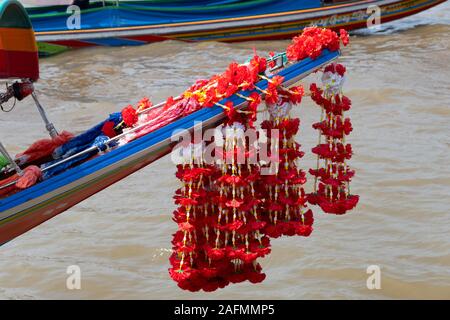Flowers decorating front of Long-tail boat, Chao Phraya River, Bangkok, Thailand Stock Photo