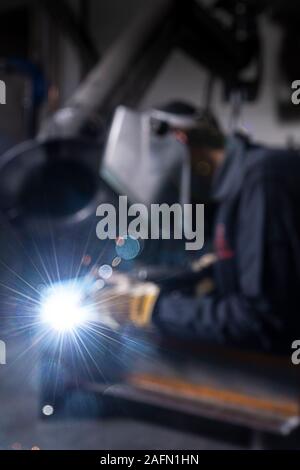 Welder welding in factory Stock Photo