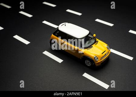 yellow mini cooper toy car