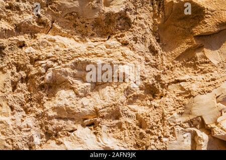 Wall sandstone texture background. Yellow old grunge surface, stone vintage texture. Voluminous background Stock Photo