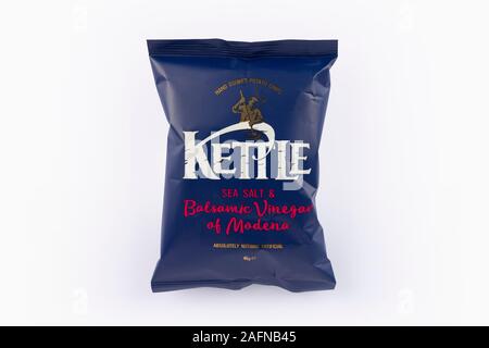 A packet of Kettle sea salt and balsamic vinegar of Modena crisps shot on a white background. Stock Photo