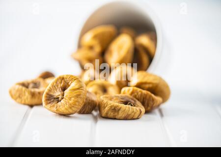 Sweet dried figs on white table. Stock Photo
