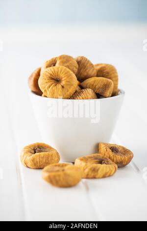 Sweet dried figs on white table. Stock Photo