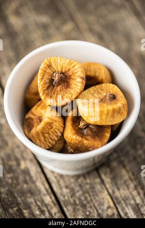 Sweet dried figs in bowl. Stock Photo