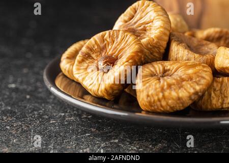 Sweet dried figs on plate. Stock Photo