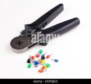 crimping tool and bootlace ferrules for electrical wires and cables Stock Photo